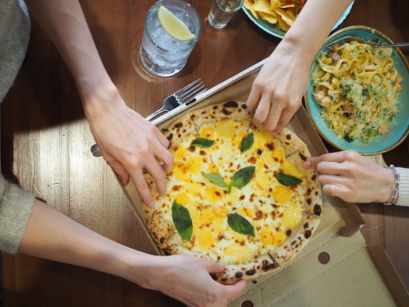 Community pizza night gathering with guests